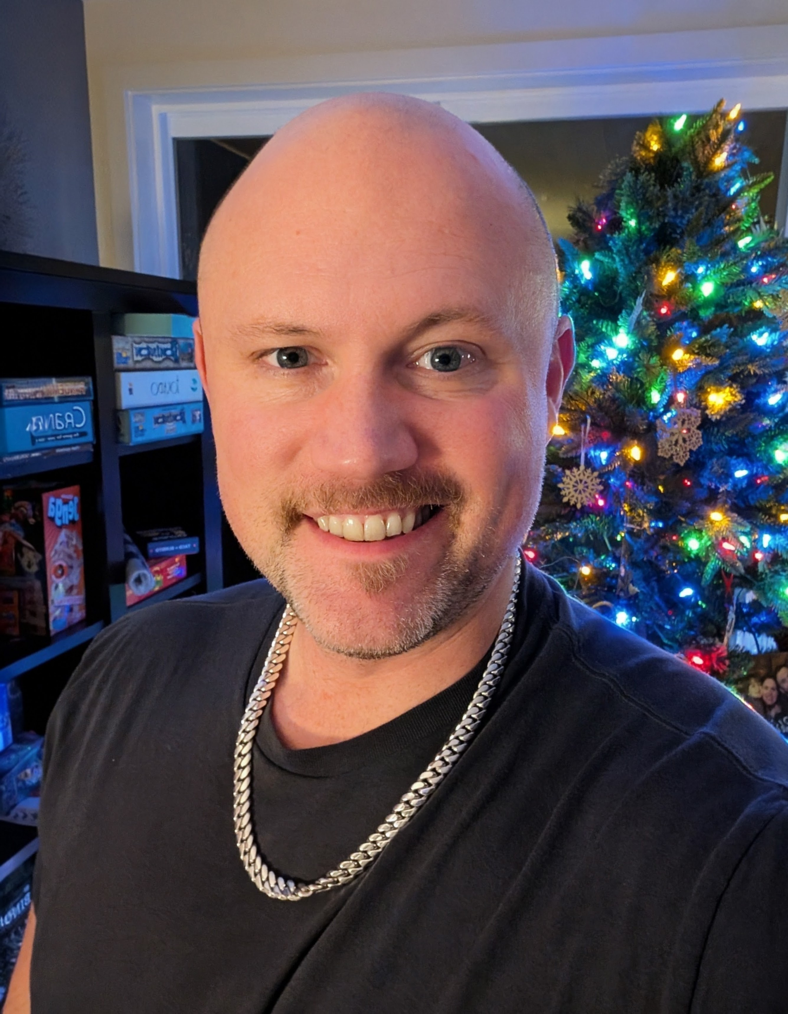 Nick Bogert smiling in a black T-shirt